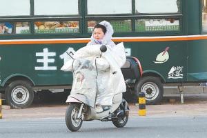 “暖流”驅寒流,，應對大風降溫 京城氣溫探底