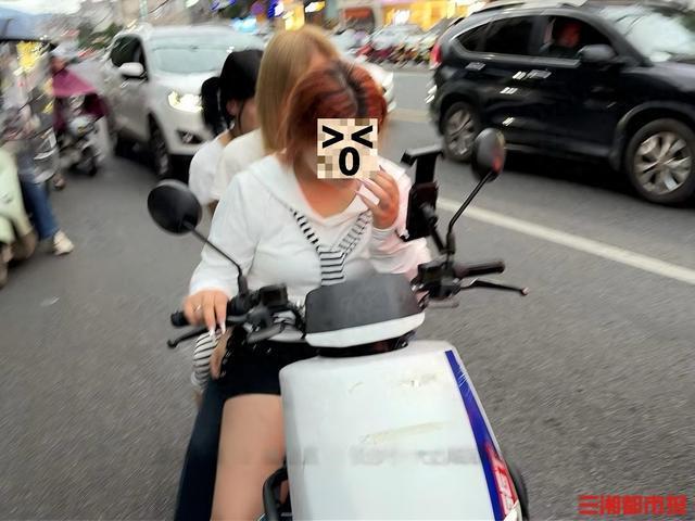 电动车载多人未戴头盔 无人机劝阻