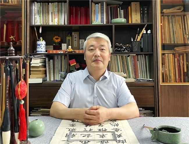 朱军民:身残志坚研书画 奉献担当暖四方