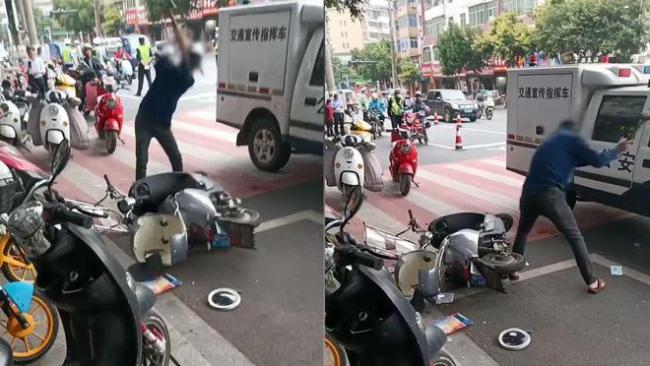 大爷当街打砸自己电动车 大爷没有考D照 一周被交警拦3次