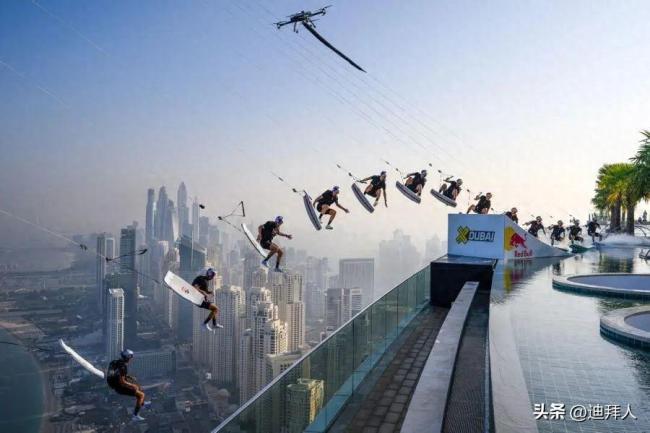 惊险刺激！美国运动员从迪拜77层高楼泳池跳下 完成定点跳伞挑战
