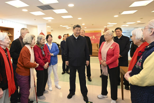 新华图讯丨习近平春节前夕在北京看望慰问基层干部群众